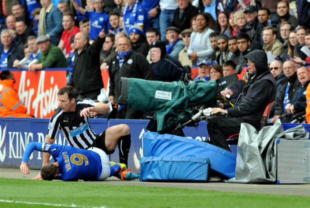 Leicester City striker Jamie Vardy suffers an uncomfortable collision with a television camera