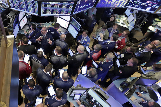 Traders gather at the post that handles Allergan on the floor of the New York Stock Exchange,Thursday Oct. 29 2015. Allergan which makes Botox jumped 8 percent after saying it has held talks with Pfizer about a sale