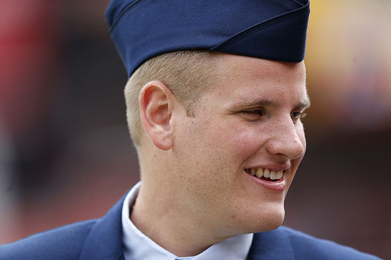 U.S. Air Force Airman 1st Class Spencer Stone who was injured stopping an attack on a Paris bound train walks along the sidelines before an NFL football game between the Washington Redskins and the St. Louis Rams in Landover Md. on Sunday Sept. 20 20