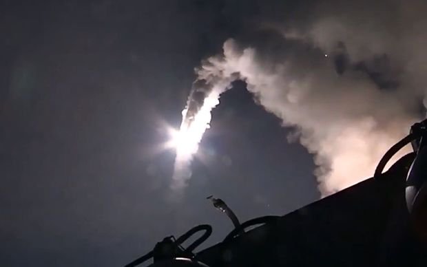 An image grab from a video released by the Russian Defence Ministry shows a Russian warship launching a cruise missile in the Caspian Sea during a strike against Islamic State in Syria