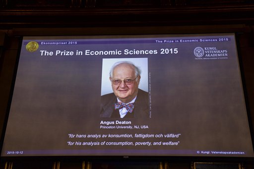 A view of the screen showing an image of Professor Angus Deaton winner of the 2015 Sveriges Riksbank Prize in Economic Sciences in Memory of Alfred Nobel as the Permanent Secretary for the Royal Swedish Academy of Sciences addresses a press conference