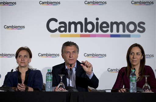 Presidential candidate Mauricio Macri center gives a press conference with his running mate Gabriela Michetti left and Buenos Aires provincial governor-elect Maria Eugenia Vidal in Buenos Aires Argentina Monday Oct. 26 2015 the day after electio