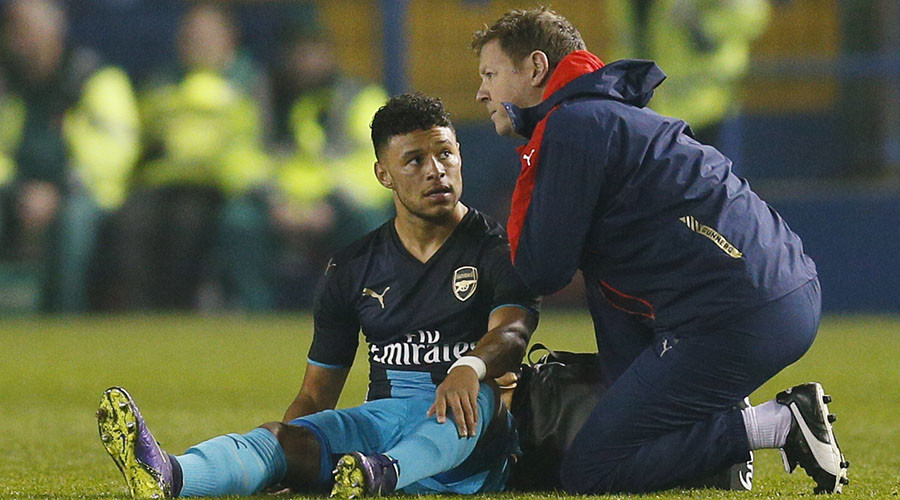 Arsenal's Alex Oxlade Chamberlain receives treatment after sustaining an injury before being substituted