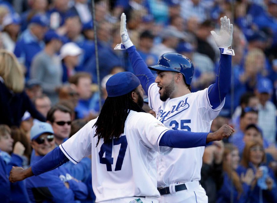 Kansas City Royals Eric Hosmer right celebrates with Johnny Cueto after scoring a run following a walk by teammate Salvador Perez during the sixth inning of Game 2 in baseball's American League Division Series against the Houston Astros Friday O