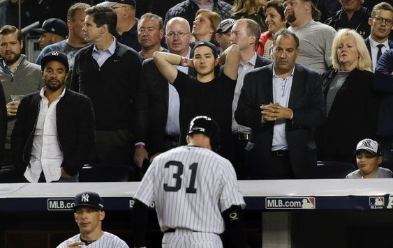 New York Yankees Greg Bird walks back to the dugout after being called out on strikes with a man on base during the seventh inning of the American League wild card baseball game against the Houston Astros Tuesday Oct