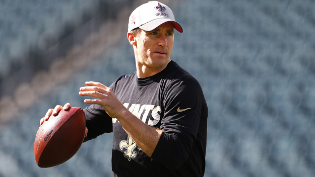 PHILADELPHIA PA- OCTOBER 11 Quarterback Drew Brees #9 of the New Orleans Saints passes during a pre game workout before a football game against the Philadelphia Eagles at Lincoln Financial Field