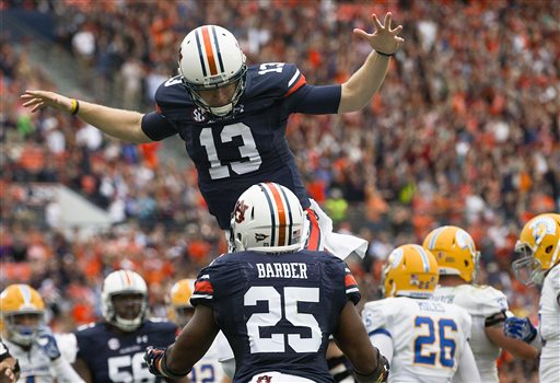 Auburn quarterback Sean White celebrates with Auburn running back Peyton Barber after Barber scored a touchdown during the first half of an NCAA college football game against San Jose State on Saturday Oct. 3 2015 in Auburn Ala. (AP