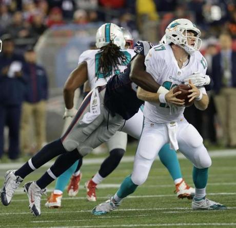 Patriots Chandler Jones sacks Dolphins quarterback Ryan Tannehill in the second quarter Thursday Oct. 29 2015 at Gillette Stadium