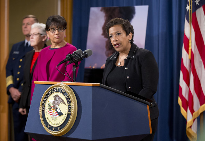 Attorney General Loretta Lynch right with from left U.S. Coast Guard Commandant Adm. Paul Zukunft EPA Administrator Gina McCarthy and Commerce Secretary Penny Pritzker speak during a news conference at the Justice Department in Washington Monday