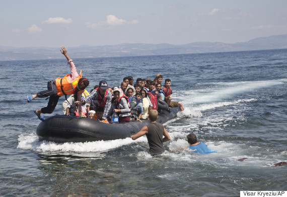 Baby rescued from sea by Turkish fishermen after refugee boat capsizes