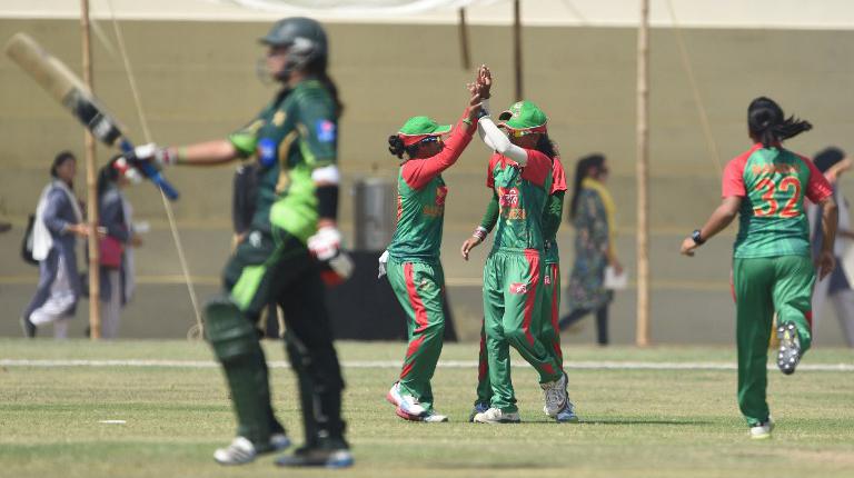 Bangladeshi cricketers celebrate the dismissal of Pakistani cricketer Marina Iqbal during the second T20 match