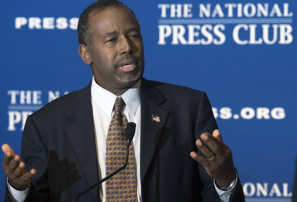 Republican presidential candidate Ben Carson gestures as he discuss his new book'A More Perfect Union What We the People Can Do To Reclaim Our Constitutional Liberties at the National Press Club in Washington DC