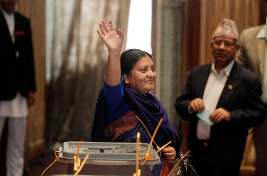 Presidential candidate and vice-chairperson of the Communist Party of Nepal Bidhya Bhandari waves her hand after casting vote as lawmakers vote for a new president in Kathmandu Nepal Wednesday Oct. 28 2015. The prime ministe