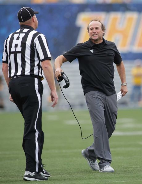 West Virginia head coach Dana Holgorsen disagrees with a call during the first half of an NCAA college football game against Maryland Saturday Sept. 26 2015 in Morgantown