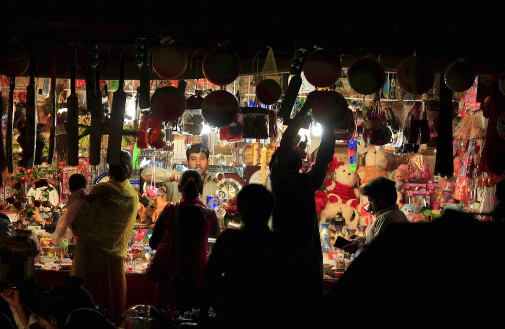 Women buy gifts from a toy shop on the outskirts of Islamabad Pakistan. Police says 5 people were killed in a suspected suicide bomb attack targeting the office of a local lawmaker in central Pakistan today. – Reuters pic