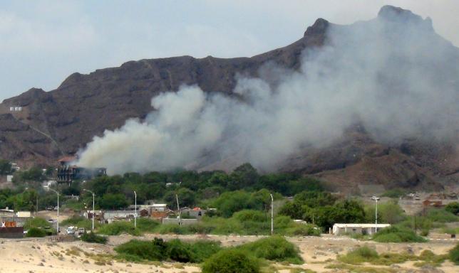 Smoke billows from al Qasr hotel after it was hit by explosions in the western suburbs of Yemen's southern port city of Aden