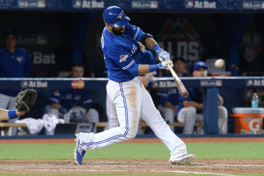 Toronto Blue Jays Jose Bautista hits a three-run home run during the seventh inning in Game 5 of baseball's American League Division Series Wednesday Oct. 14 2015 in Toronto. The Toronto Blues Jays beat the Texas Rangers 6-3. (Chris Young  The Canadian