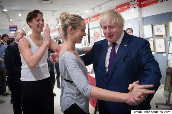 Boris johnson passes sporting baton from london to tokyo