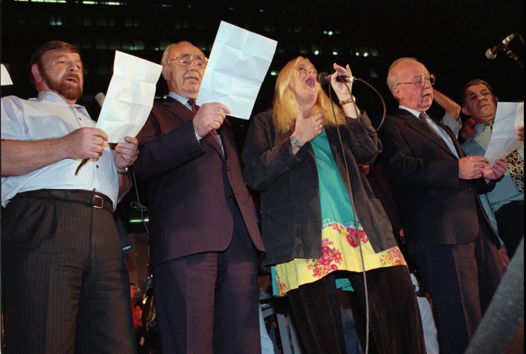 The night of the murder  Prime minister Yitzhak Rabin Miri Aloni foreign minister Shimon Peres and Knesset speaker Shevah Weiss sing a Song for Peace at the end of a rally in Tel Aviv on Saturday