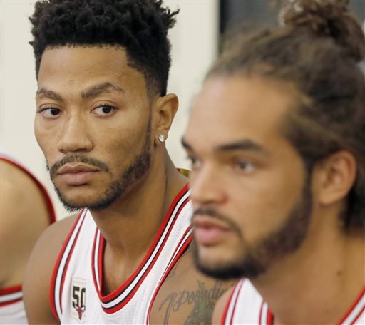 Chicago Bulls guard Derrick Rose left listens to Joakim Noah during an NBA basketball media day news conference Monday Sept. 28 2015 in Chicago