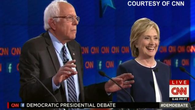 The two candidates shared a laugh and a handshake following Sanders&#39 remark about the investigation into Clinton's email