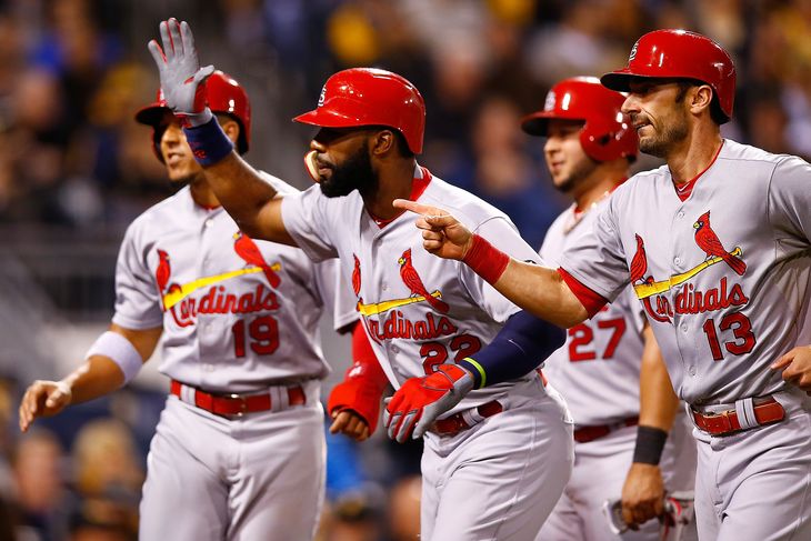 Cardinals teammates congratulate Jason Hayward after a grand slam in Wednesday's 11-1 win over the Pittsburgh Pirates