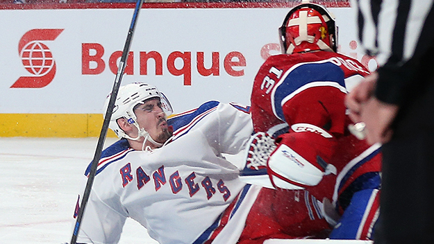 Chris Kreider of the New York Rangers slides into Carey Price of the Montreal Canadiens during the second period in Game One of the 2014 Eastern Conference Final