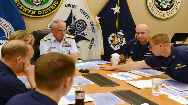 Rear Adm. Scott Buschman commander of the Coast Guard 7th District receives an update brief for the missing cargo ship El Faro at the Coast Guard 7th District in Miami Saturday Oct. 3 2015. The ship was heading from Jacksonville Fla to San Juan Pu