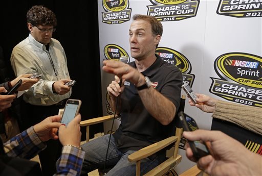 Driver Kevin Harvick center answers a question during the NASCAR Sprint Cup series auto racing Eliminator Media Day in Charlotte N.C. Tuesday Oct. 27 2015