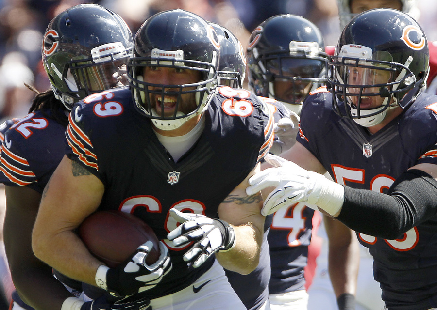 Jared Allen of the Bears celebrates an interception from the Arizona Cardinals on Sunday