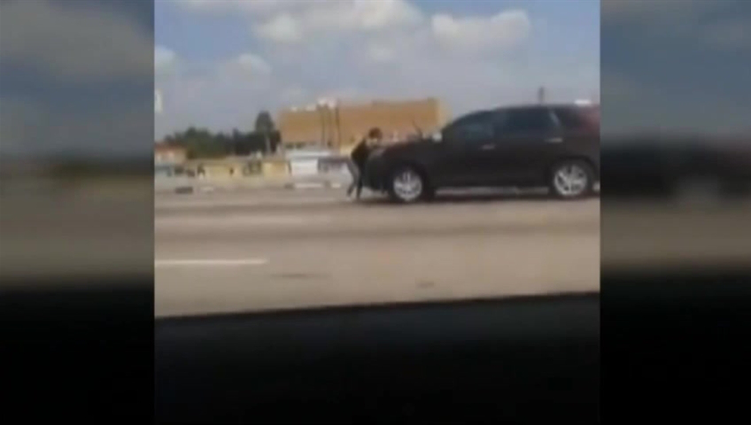 Pregnant woman rides on hood of SUV for a mile on Houston highway in fight