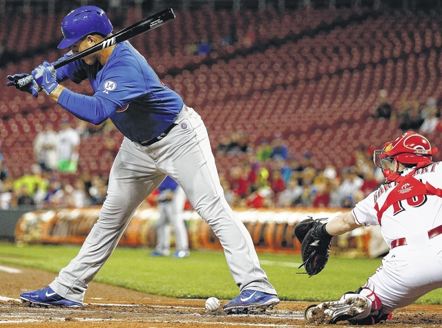 Chicago Cubs first baseman Anthony Rizzo is hit by a pitch from Cincinnati Reds’ Josh Smith in the first inning of a game Tuesday in Cincinnati