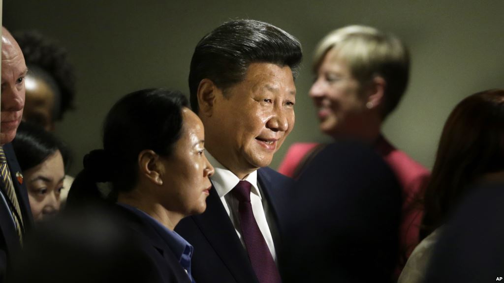 Chinese President Xi Jinping leaves a meeting on gender equality and women's empowerment at United Nations headquarters Sunday Sept. 27 2015