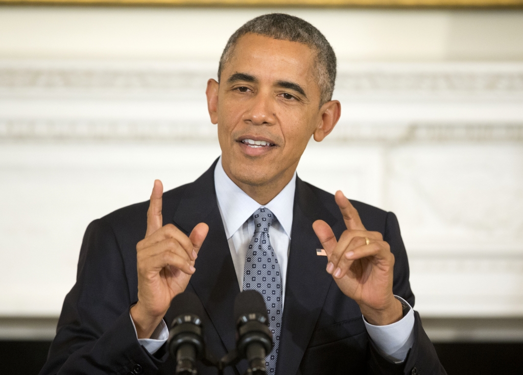 President Obama gestures as he answers question from members of the media during a news conference in the State Dining Room of the White House in Washington Friday