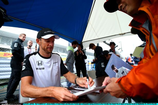 Signing on the dotted line Jenson Button agreed a new one-year deal with Mc Laren but this time was signing autographs