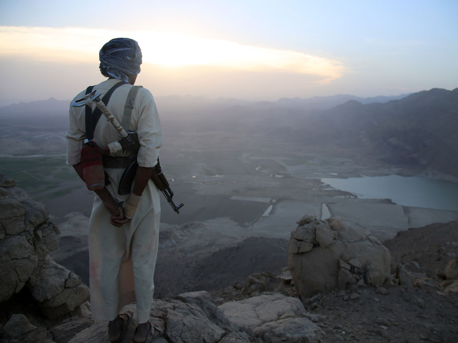 A Yemeni tribesman from the Popular Resistance Committees supporting forces loyal to Yemen's Saudi-backed fugitive President Abedrabbo Mansour Hadi stands overlooking the great Dam of Marib on Monday. The UN says 2,355 civilians have been killed