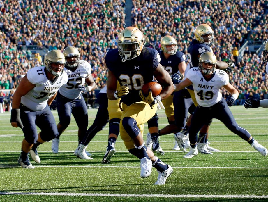 Notre Dame running back C.J. Prosise runs in for a touchdown against Navy during the first half of an NCAA college football game Saturday Oct. 10 2015 in South Bend Ind