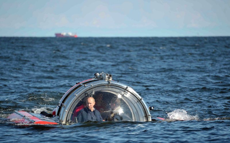 Russia's President Vladimir Putin is seen through the glass of C Explorer 5 submersible after a dive to see the remains of the naval frigate'Oleg, which sank in the 19th century in the Gulf of Finland in the Baltic Sea