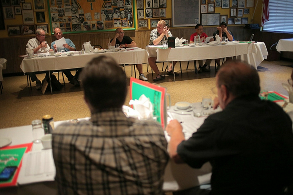 Members of the Greater Oakland Professional Pigskin Prognosticators League hold their annual fantasy football draft at Francesco’s restaurant in Oakland CA September 2015