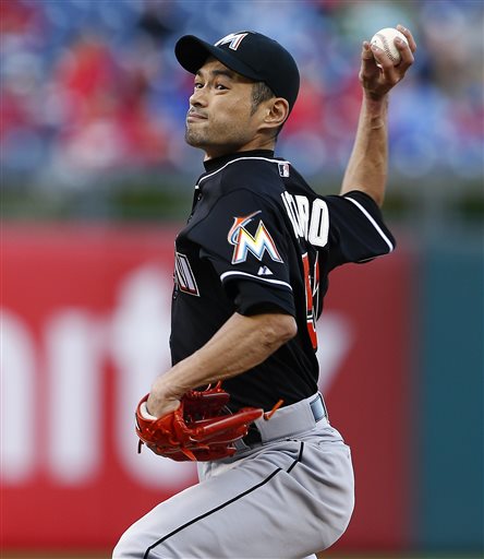 Miami Marlins manager Dan Jennings left watches his team play the Tampa Bay Rays during the first inning of a baseball game Thursday Oct. 1 2015 in St. Petersburg Fla