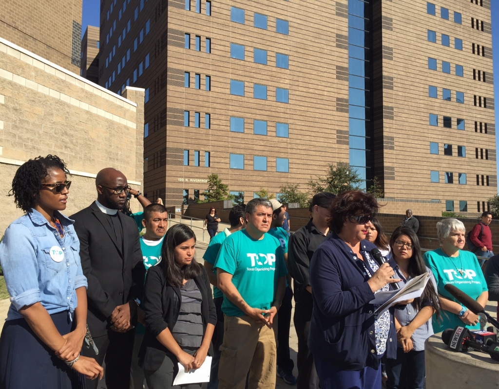 Members of the North Texas Immigration Coalition call for Sheriff Lupe Valdez to stand up to Texas Gov. Greg Abbott at a Tuesday news conference near the jail