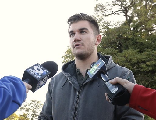 Alek Skarlatos one of the three Americans who stopped a terrorist attack aboard a Paris-bound train in August talks to reporters about the shooting at Umpqua Community College in Roseburg Ore. Skarlatos