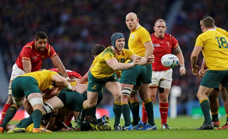 David Pocock clears the ball from a ruck during Australia's win over Wales