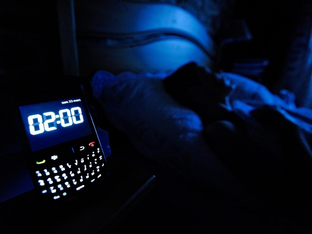 80 per cent of us keep our phones on overnight with 50 per cent using them as an alarm clock