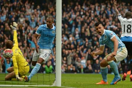 Manchester City's striker Sergio Aguero reacts after scoring during an English Premier League football match between against Newcastle United at The Etihad Stadium in Manchester north west England