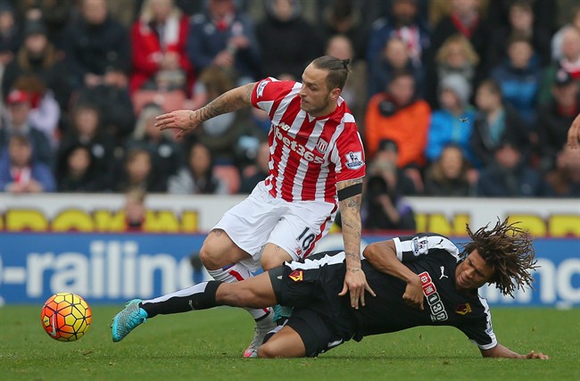 Stoke City's Marko Arnautovic top is fouled by Watford's Nathan Ake during the English Premier League soccer match between Stoke City and and Watford at the Britannia Stadium in Stoke England Saturday Oct. 24 2015