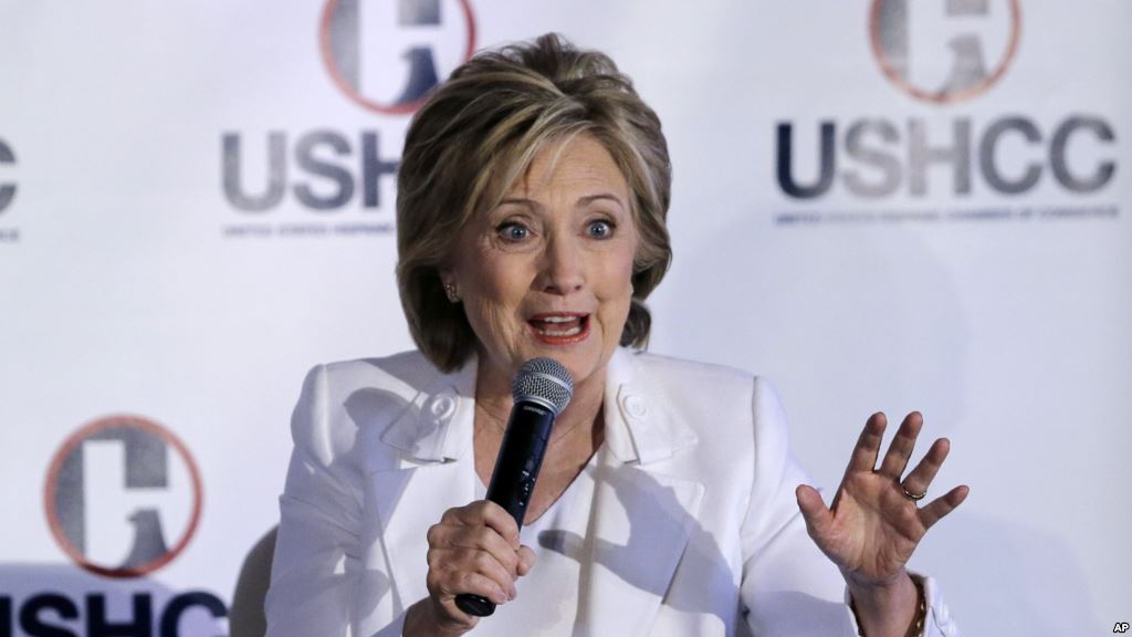 Democratic presidential candidate Hillary Rodham Clinton reacts to a supporter before speaking at a community forum