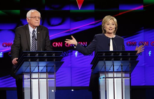 Hillary Rodham Clinton right speaks as Sen. Bernie Sanders of Vermont looks on during the CNN Democratic presidential debate Tuesday Oct. 13 2015 in Las Vegas