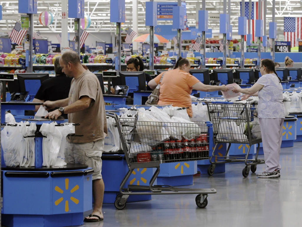 Despite slower growth consumers like these at a Wal Mart in Arkansas continued spending