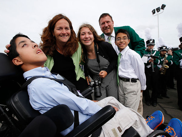 Michael Keating left 10 was blessed by Pope Francis after he landed at Atlantic Aviation in Philadelphia on Sept. 26 2015. Michael suffers from cerebral palsy. He is surrounded by his family L-R mother Kristin sister Katie father Chuck and twin